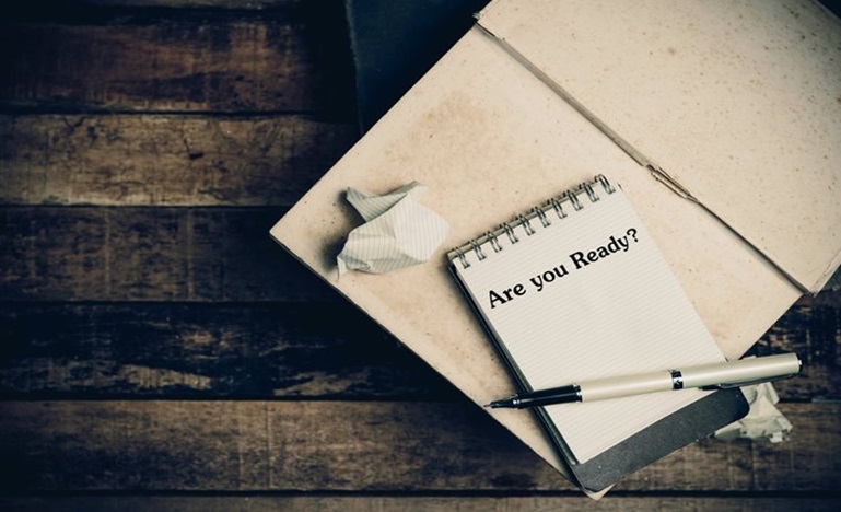 notebooks, crumpled paper and pen, one notebook with note - Are You Ready