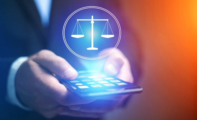 glowing image of a set of scales hovering above a cell phone
