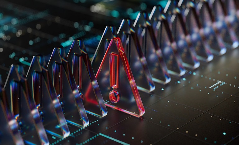 series of clear triangle tiles atop a computer board interior, with one red tile containing an exclamation mark standing out