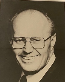 black and white portrait - headshot - of Alan Marshal, a photo taken during his OBA presidency