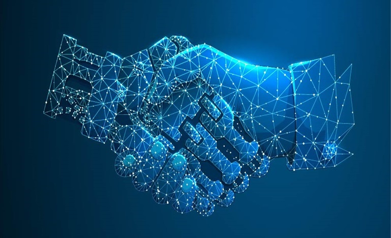 A robot hand grasping a human hand outlined in stars