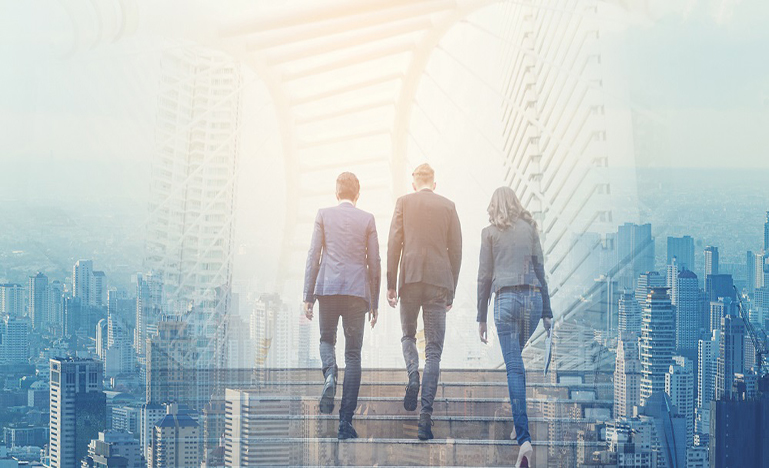 Three people climbing a stairs