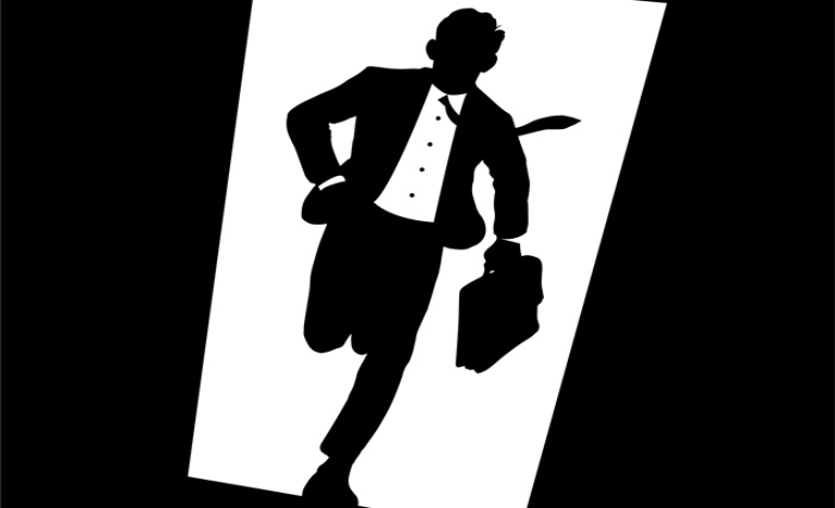 black and white image of businessman in suit and tie, with briefcase, racing through open door