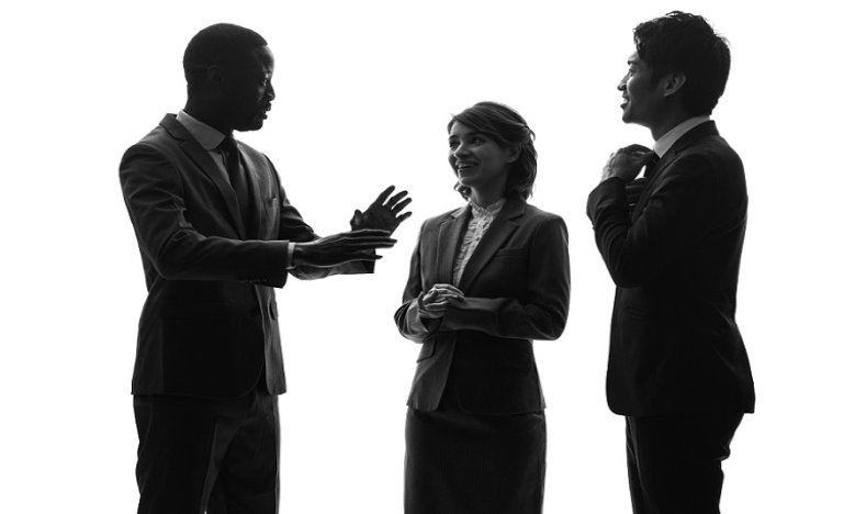 Silhouettes of Three People talking